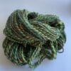 il_fullxfull.4690622929_a7xw.jpg Hand spun Shetland yarn combined with merino and sari silk in forest greens.