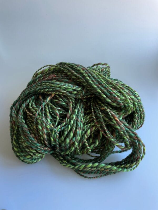 il_fullxfull.4690623043_rbas.jpg Hand spun Shetland yarn combined with merino and sari silk in forest greens.