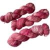 Hand dyed superwash Merino and bio nylon sock weight yarn. Warm pink and white with fluorescent speckles.