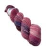 Hand dyed super wash Merino and bamboo sock yarn in warm red, pink and blue.