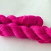 Semi solid superwash Merino yarn. ‘Neon pink’