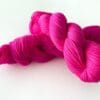 Semi solid superwash Merino yarn. ‘Neon pink’