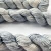 il_fullxfull.6816526662_64o3.jpg Hand dyed superwash superfine Merino, Alpaca and mulberry silk fingering weight yarn. Ombre steel grey.