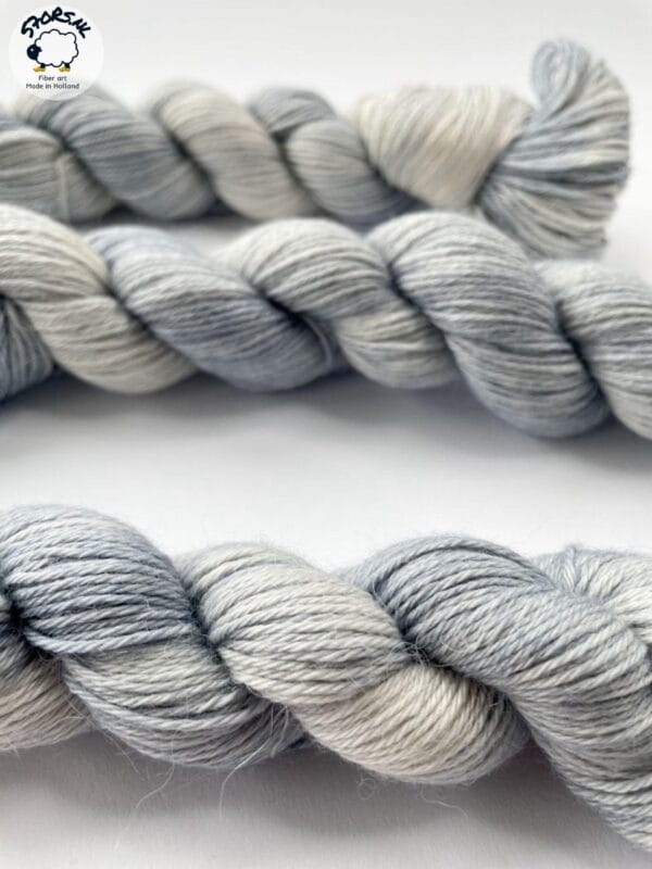 il_fullxfull.6816526662_64o3.jpg Hand dyed superwash superfine Merino, Alpaca and mulberry silk fingering weight yarn. Ombre steel grey.