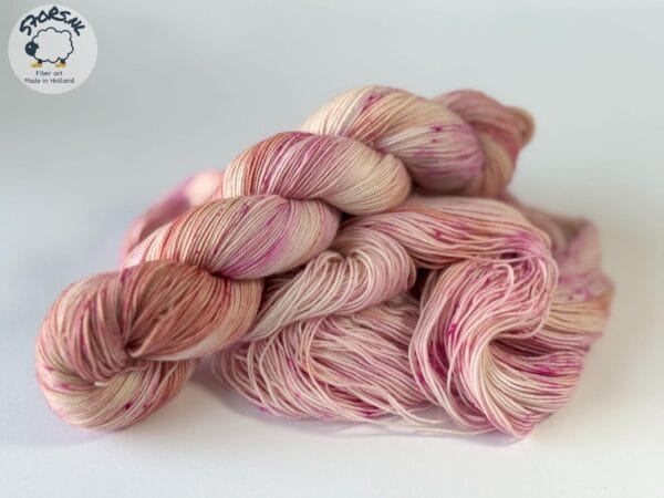 Hand dyed superwash Merino and nylon yarn. ‘Pink Champagne’.