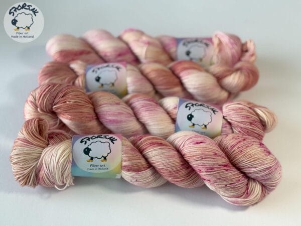 Hand dyed superwash Merino and nylon yarn. ‘Pink Champagne’.