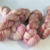 Hand dyed superwash Merino and nylon yarn. ‘Pink Champagne’.