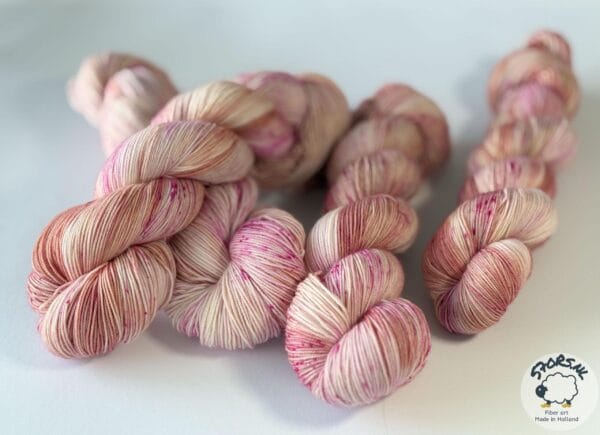 Hand dyed superwash Merino and nylon yarn. ‘Pink Champagne’.
