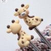 51ABAFE0-D844-488D-9A7B-53349113C3ED “Knitting Buddies” Needle Stoppers