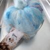 notion-3 Blue and white S7oRS Art Batt with coloured fibres in a metal tray.