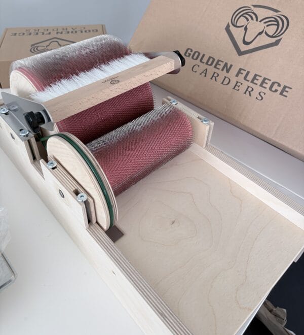 notion-4-safe New Golden Fleece drum carder next to its packaging in the studio.